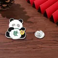 Cartoon panda enamel pin holding a green mahjong tile on dark wood background - Panda Holding Fortune Mahjong Style (C2689-1)