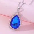 Macro shot of Sofia amulet necklace with large blue teardrop crystal and silver filigree - Blue (A2839-6)