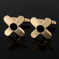 Detailed macro shot of gold cufflinks with black enamel center on a mirrored surface - Pair of Cufflinks (B1524)