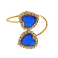 Elegant gold open bangle featuring two blue heart crystals with sparkling rhinestone borders - Blue