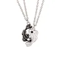 Detail shot of Yin Yang Koi fish necklaces with black and white enamel finish - Black And White Fish Necklace (A3195)