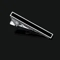 Close-up of polished silver alloy men's tie clip with black enamel inlay for business - Tie Clip Only (T1069-BL)
