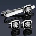 Polished silver men's business tie clip and lion head cufflinks set on blue background - Silver Lion Set