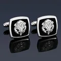Macro shot of silver lion head cufflinks on black square frame with mirror reflection - Silver Lion Cufflinks