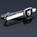 Macro detail of silver tie clip featuring a 3D wolf head emblem on black enamel square - Silver Wolf Tie Clip