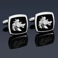 Detailed close-up of men's silver animal cufflinks with black enamel on a reflective surface - Silver Griffin Cufflinks