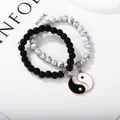 Detail of Yin Yang couples bracelets with black obsidian and white marble beads - Black White Pairing Elastic Beaded Style (G1248-2)