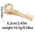 Elegant gold-tone key-shaped metal tie clip with a polished finish for men's formal wear - Key Shape (T1063-18)