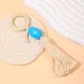 Detalle de un servilletero de madera hecho a mano con cuenta azul y borla de algodón suave - Anillo Madera Colgante Azul Borla (Z1236-BLU)