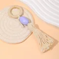 Detalle de servilletero de cuentas de madera con acento morado y borla de algodón artesanal - Anillo Madera Colgante Púrpura Borla (Z1236-PU)