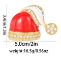 Detail view of red Christmas hat brooch with rhinestones showing dimensions 3.4cm by 5.0cm - Rhinestone Santa Hat (C2733-32) / Gold