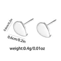 Macro shot of minimalist silver pebble heart stud earrings with size and weight specs - Water Drop