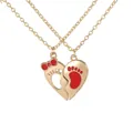 Golden heart puzzle necklace set with red bow and baby footprint pendant detail - Gold Red (A3306-GO-RE)
