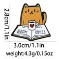 Cartoon orange cat reading book enamel pin with coffee cup and heart detail - Orange Cat Reading And Coffee