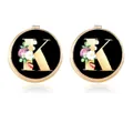Men's gold cufflinks featuring letter K with floral patterns on black background - Letter K Style