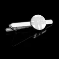 Polished silver tie clip with textured geometric grid pattern on a black mirror surface - Regular Tie Clip (T1024)