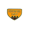 Triangle shield badge pin with mountain peaks and Adventure Awaits text - C2844