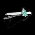 Detailed close-up of a silver tie clip featuring a green enamel Christmas tree design - Christmas Tree Tie Clip (T1120)