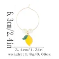 Detail view of lemon fruit charm hoop earring with size dimensions 6.3cm by 3.4cm - Yellow Lemon