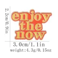 Enjoy the NOW text pin badge with yellow letters on an orange metal background - Enjoy The Now Style (C2907)