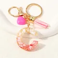 Detail of resin letter C keychain with pink tassels and gold flakes on white ceramic - Style C(D1416-C)