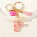 Detail of resin letter F keychain with pink gold foil, tassel and heart charm - Style F(D1416-F)