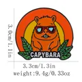 Detailed view of enamel capybara pin with red sunglasses and dimensions 3.0cm by 3.3cm - Sunset Background Style (C3058-2)
