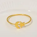 Macro shot of gold moon and star napkin ring with metallic luster on white ceramic - Star Moon Style (Z1211)