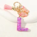 Portachiavi lettera L in resina viola con paillettes, nappa rosa e farfalla - Alfabeto L (D1414-L)