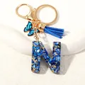 Letter N crystal keychain with blue resin stones, gold foil, butterfly and tassel - Letter N (D1413-N)