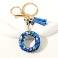 Blue tassel and butterfly resin keychain with letter pendant and gold lobster clasp - Letter O (D1413-O)