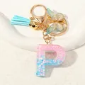Letter P glitter resin keychain with blue tassel and gold butterfly charm accessory - Letter P (D1417-P)