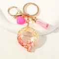 Pink resin letter Q keychain with gold leaf, heart charm and tassel detail - Style Q(D1416-Q)