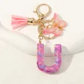 Portachiavi lettera U con paillettes viola, nappa rosa e ciondolo a farfalla - Alfabeto U (D1414-U)