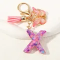 Portachiavi con lettera X in resina viola scintillante con farfalla e nappa rosa - Alfabeto X (D1414-X)