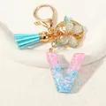 Pink and blue gradient resin letter V keychain with gold butterfly and blue tassel - Letter V (D1417-V)
