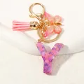 Portachiavi lettera Y in resina viola glitter con farfalla e nappa rosa soft - Alfabeto Y (D1414-Y)