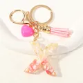 Gold-plated keychain with pink resin letter X, heart charm and matching tassel - Style X(D1416-X)