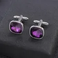 Detailed macro view of silver alloy cufflinks featuring large faceted purple crystal stones - Purple