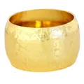 Detailed view of wide golden napkin ring with embossed floral patterns and matte texture - Gold (Z1355-1)