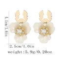 Elegant white pearl flower earrings with rhinestones and gold-tone metal hooks - Hollow Pendant Flower Style (B1655-1)