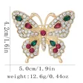 Elegant gold butterfly brooch with white crystals and vibrant green and red gemstones - White and Green Gem Style (C3393-3)