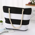 Large black and white striped canvas tote bag with thick rope handles and silver eyelets - Black and White