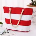 Red and white striped canvas tote bag with thick hemp rope handles for beach leisure - Red & White