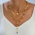 Gold layered necklace set with heart pendants and colorful gemstones in sunburst design - 6589201hb