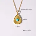 Detailed macro view of 14K gold teardrop pendant necklace with turquoise stone inlay - Turquoise Blue