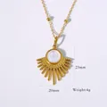 Detailed view of sunburst gold pendant necklace with white stone inlay and bead chain - Necklace / Gold-White Shell