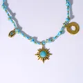 Sky blue woven rope necklace with gold sun pendant and turquoise stone detail - Sun and Evil Eye Style (2)