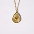 Bohemian gold water drop pendant necklace with brown stone and radial pattern - Tigers Eye