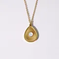 Golden teardrop pendant necklace with sunburst texture and centered pearl inlay - White Shell